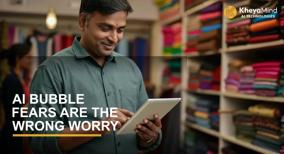 Indian SMB owner reviewing AI demand forecasting dashboard on laptop in a textile warehouse in Surat with fabric rolls in background